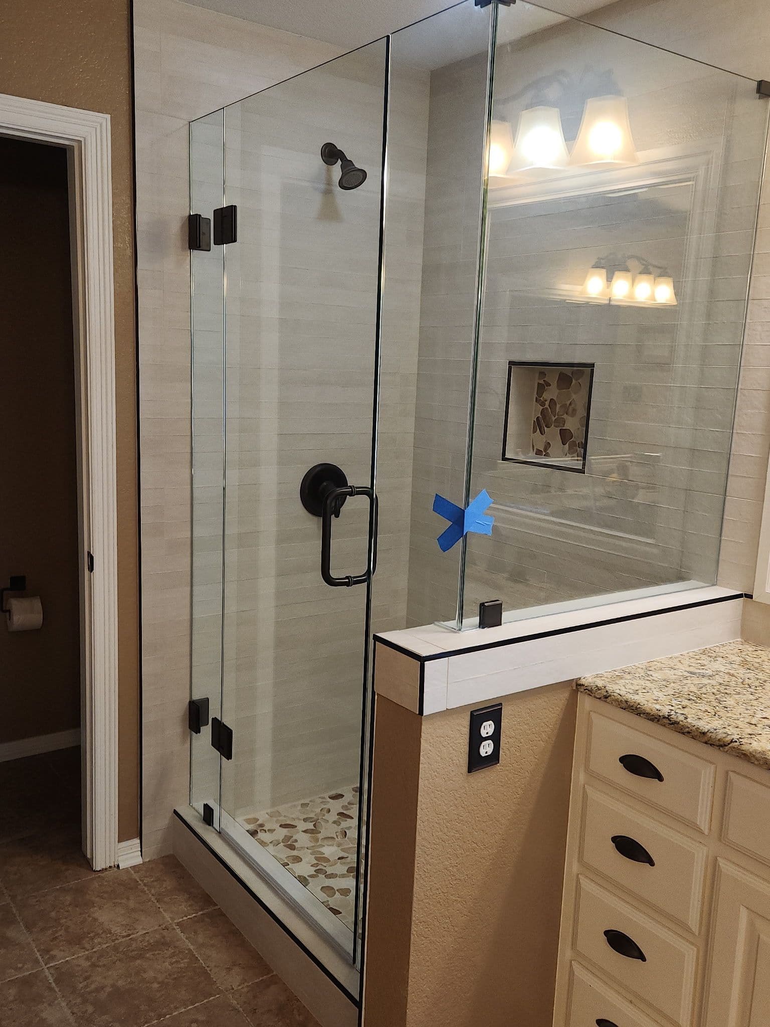 Glass-to-Glass Hinge Frameless Shower with a Centered Door Design image
