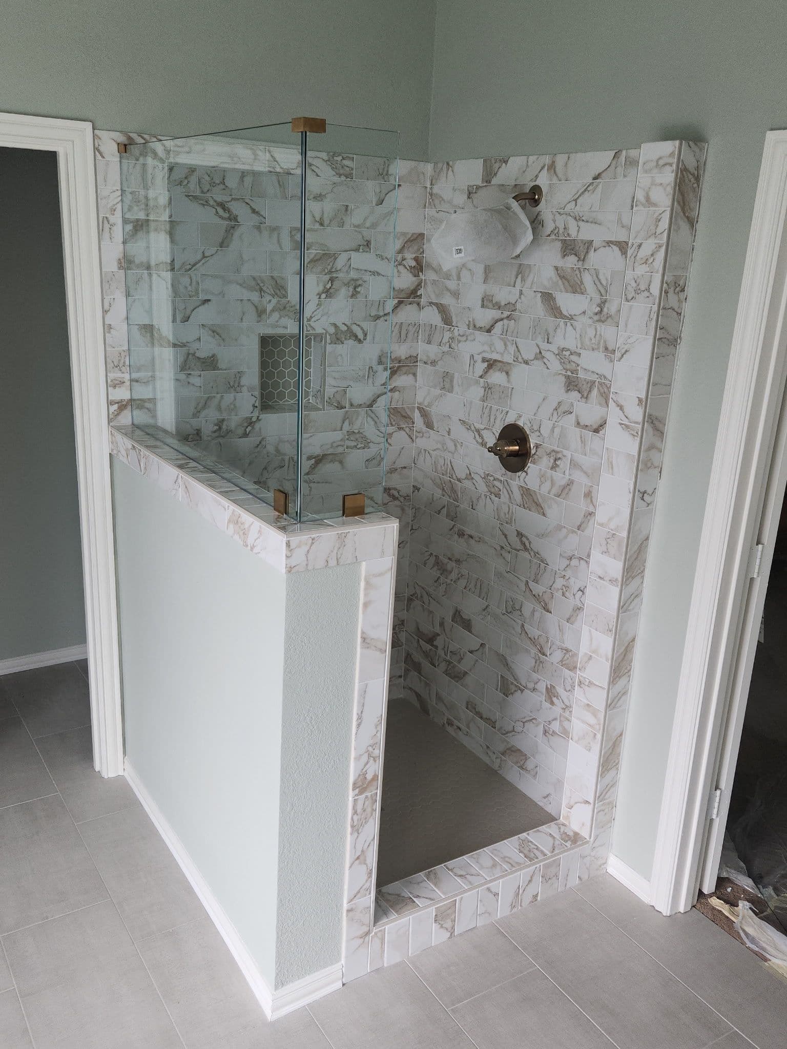 Project Frameless Shower Enclosure with Champagne Finish Hardware image