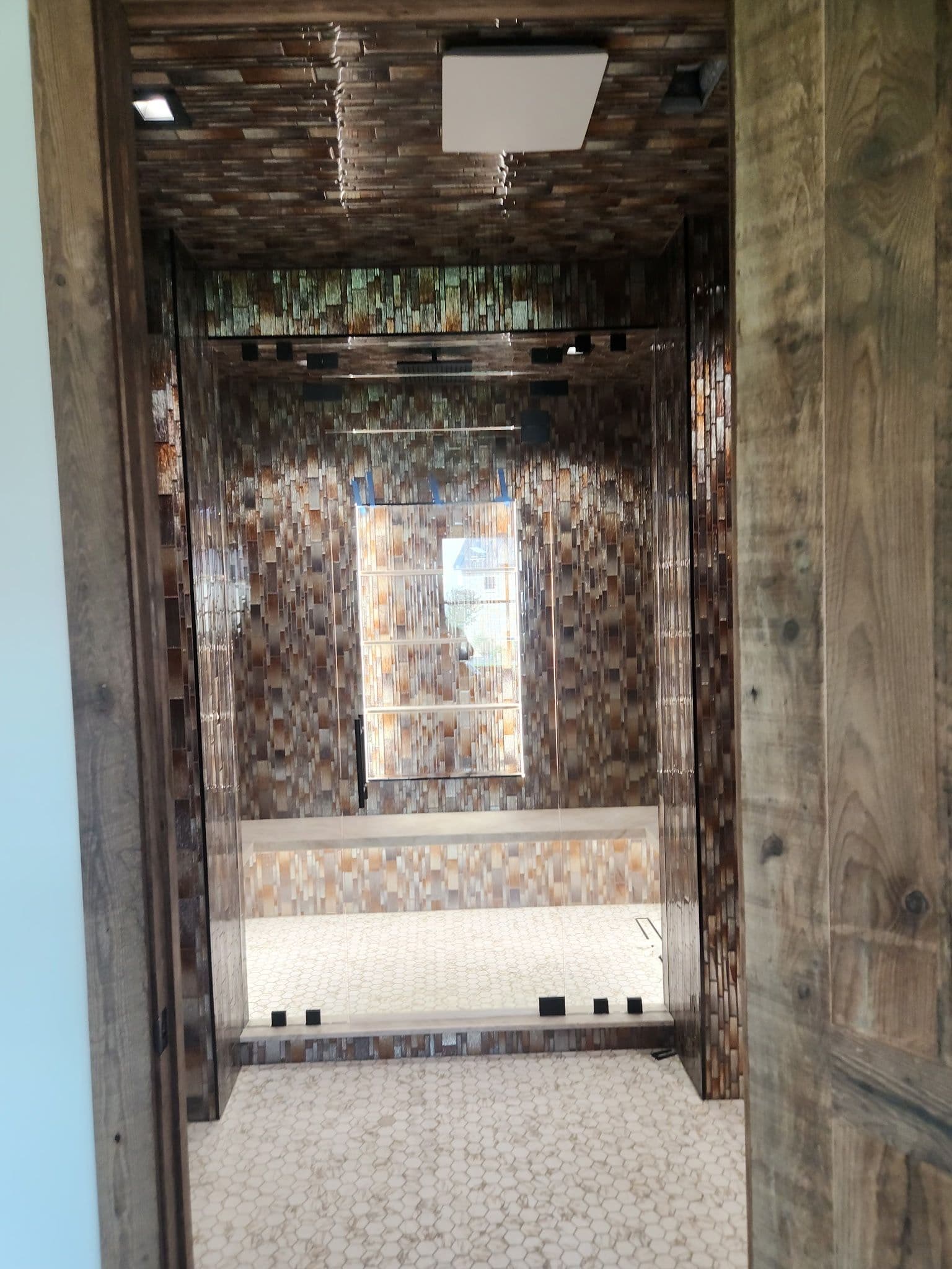 Project Frameless Glass Enclosure That Lets Stunning Tile Do the Talking image
