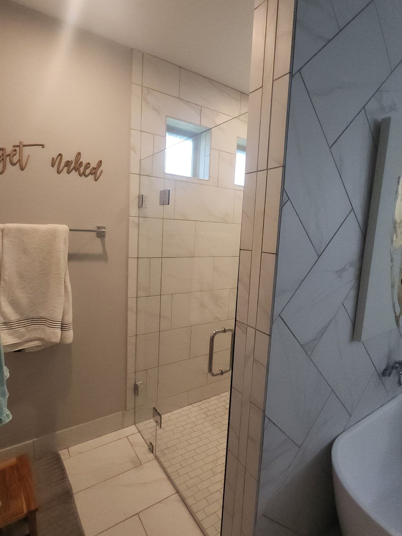 Frameless Shower Door Install That Lets the Tile Do the Talking image