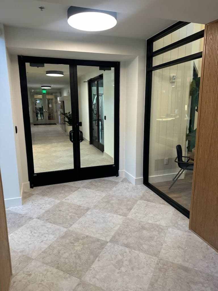 Elegant Glass Storefront Doors Elevate Interior Design