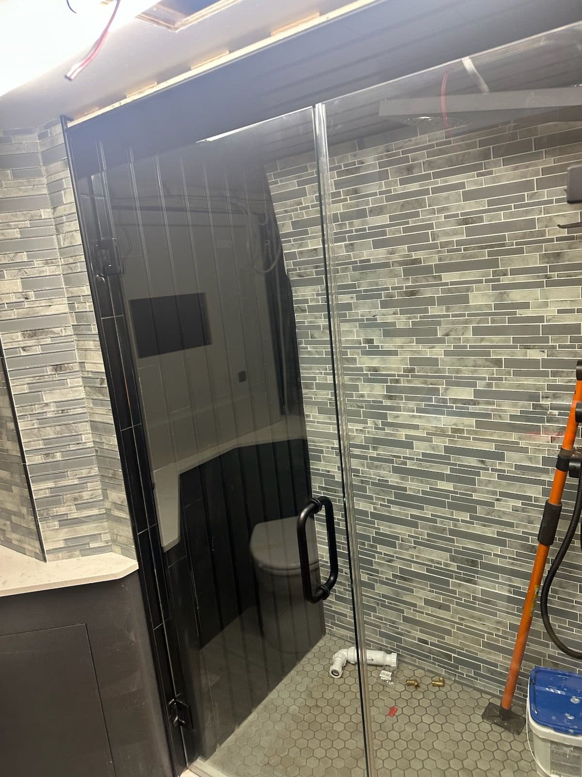 Project Tour Bus Shower Upgrade with Sleek Frameless Design image