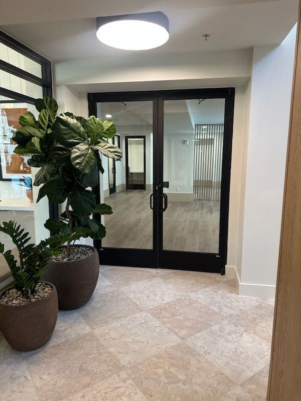 Gallery photos for Elegant Glass Storefront Doors Elevate Interior Design: Image #1