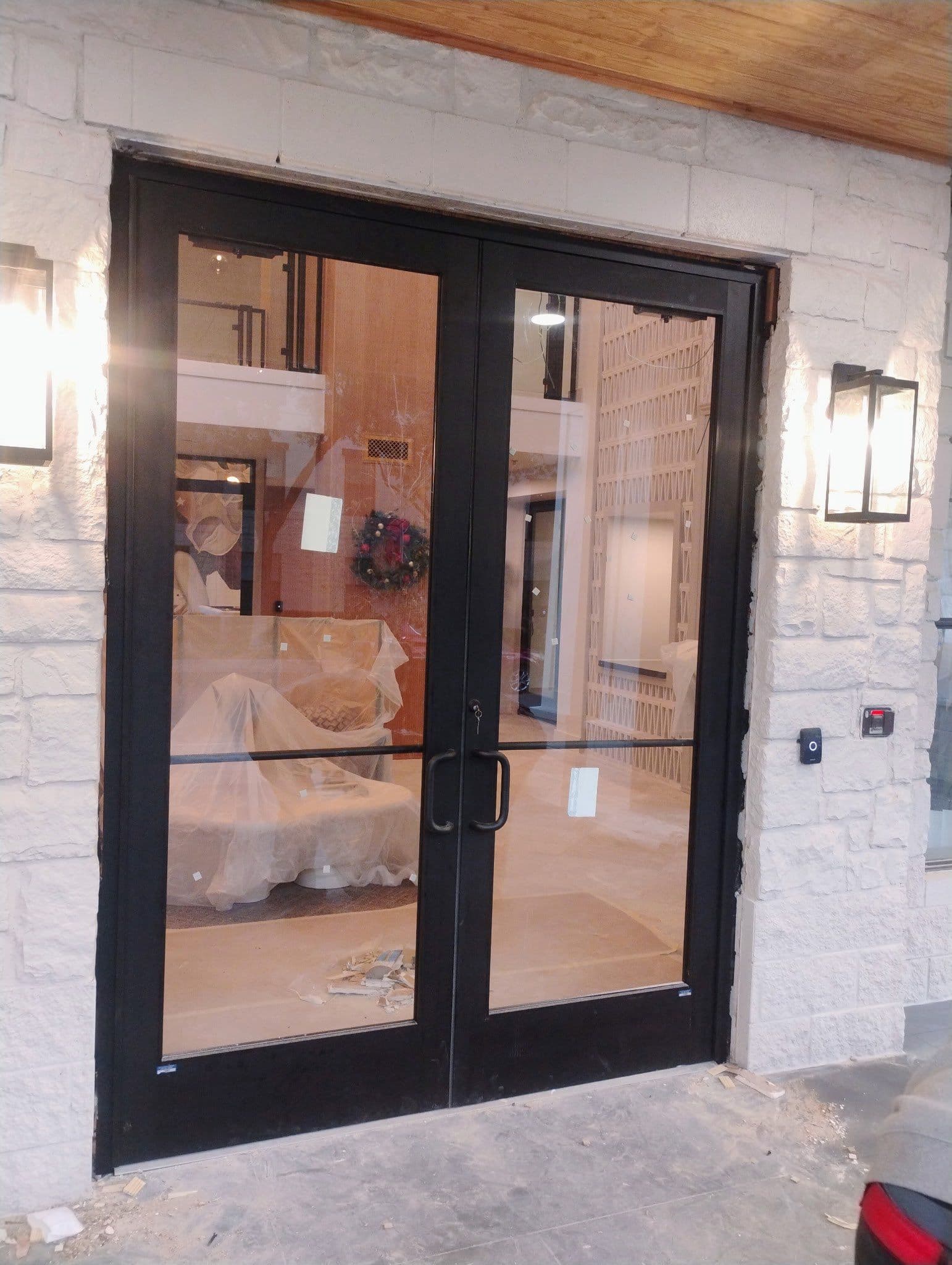 Sleek Black Glass Doors Installed for Apartment Office image